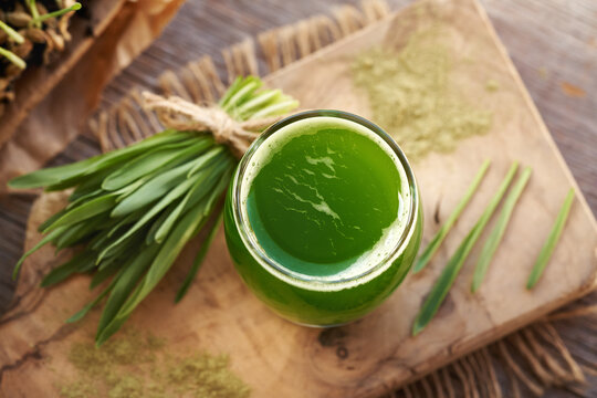 Fresh green barley grass juice with homegrown barleygrass blades