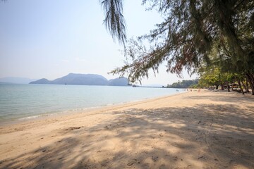 Golden Sunburst over Pristine Tropical Beach and Distant Islands