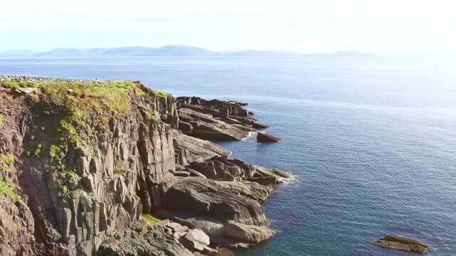Rocky Atlantic coastline and Dingle Bay, near the village of Ventry, off Slea Head Drive on the Dingle Peninsula in County Kerry, Republic of Ireland.