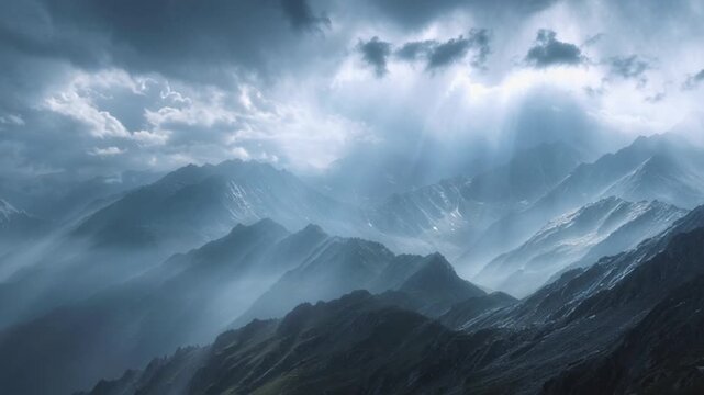 Dramatic mountain landscape with sunbeams piercing through stormy clouds