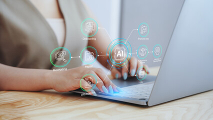 Businesswoman using laptop with virtual AI human resources dashboard and workflow icons. Concept of HR automation, smart recruiting strategy, digital employee management, and workforce analytics.