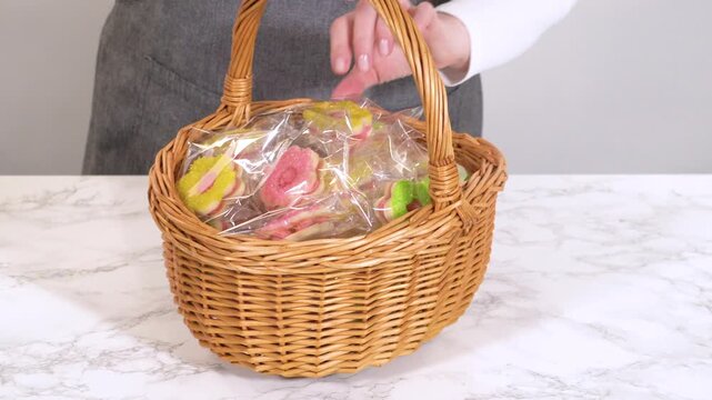 Holding Wrapped Cookie Basket at Waist Level