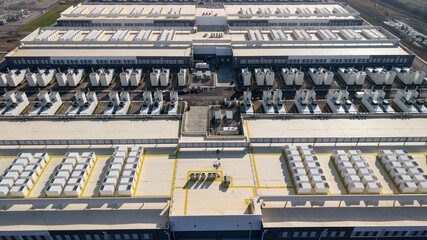 Fototapeta premium Massive data center facility cooling units aerial view in Ohio, USA.