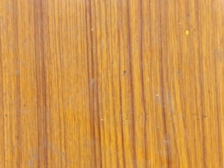 Natural Yellow Wood Grain Texture - Detailed Background of Polished Timber Surface with Vertical Brown Grooves and Organic Pattern