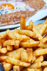 close up of delicious french fries on plate