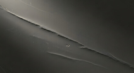 Close view of dark textured stone with visible lines and scratches providing a sense of depth and dimension