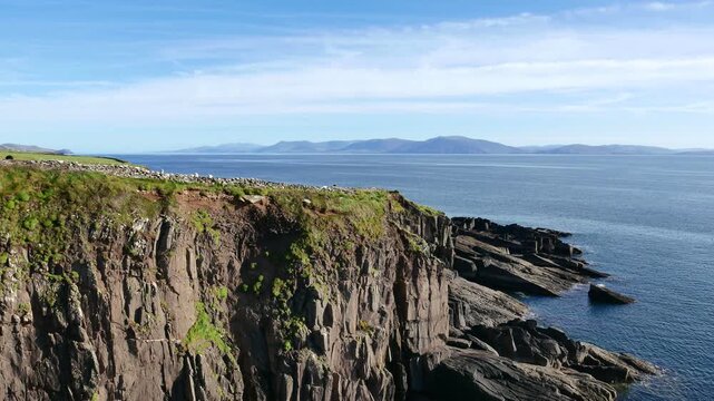 Rocky Atlantic coastline and Dingle Bay, near the village of Ventry, off Slea Head Drive on the Dingle Peninsula in County Kerry, Republic of Ireland.