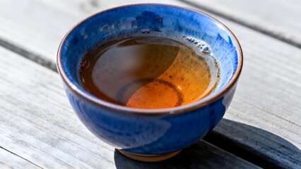 Blue Ceramic Tea Cup on Wooden Table