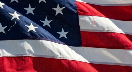 Fototapeta premium American flag waving in the wind with stars and stripes
