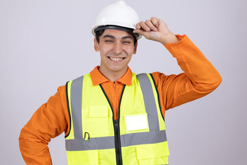 Engineer in safety vest and hardhat adjusting his headgear
