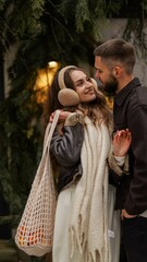 Young couple embracing outdoors during winter, sharing a tender moment of connection