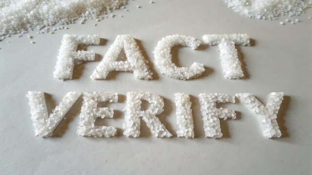 Text made from sugar granules spelling out Fact Verify