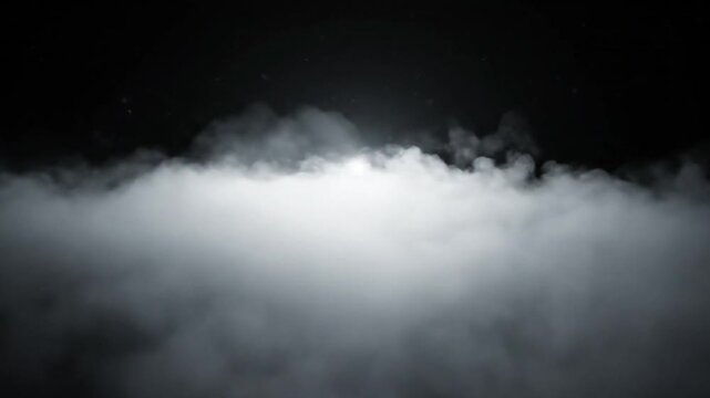 White fog floats in air with light shining through from unknown location outside