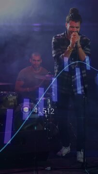 Vertical video: Lead singer singing, driving music waveform and values with drummer playing onstage