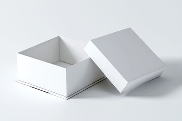 Open, white square box with lid on a white surface, casting a soft shadow