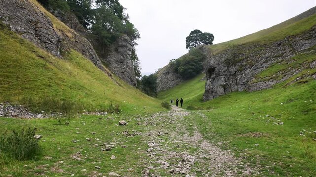 People Walking  In The Distance At Cave Dale, Castleton Video
