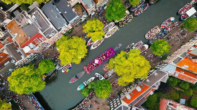 Amsterdam Aerial View During Gay Pride Celebration, Orange Crowds Filling Amsterdam From Above on King&rsquo;s Day, Amsterdam City Aerial During King&rsquo;s Day Festivities