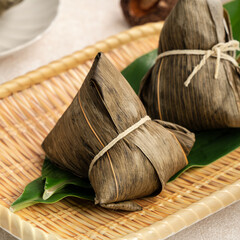 Zongzi, rice dumpling for Dragon Boat Festival on white table background.