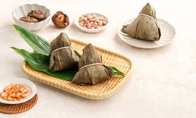 Zongzi, rice dumpling for Dragon Boat Festival on white table background.