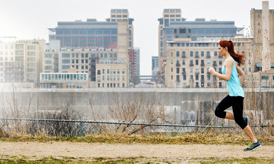 Obraz premium Thinking, woman and running for fitness in city for exercise, cardio training and morning routine. Runner, reflection and sprint for challenge, endurance workout and performance for wellness outdoor