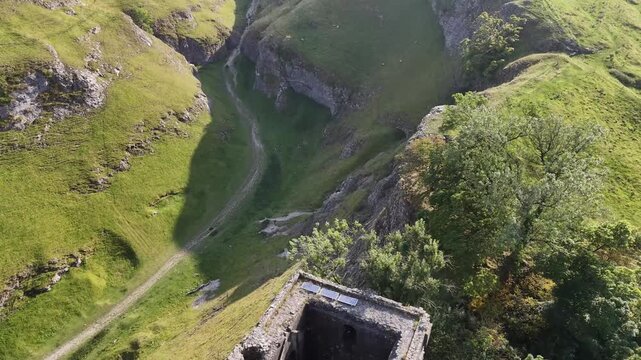 Aerial view over Peveril Castle, Castleton, Derbyshire, 4K Video.
