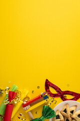 Obraz premium Vibrant vertical Purim scene with a bright yellow backdrop, colorful props, mask, hats, ribbons, and confetti. Festive mood, playful masquerade, joyful greeting, celebratory decor, lively celebration