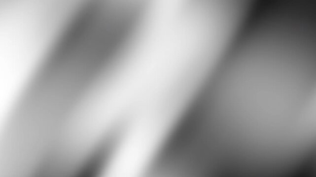 Abstract blurry black grey and white image with diagonal lines, suitable for backgrounds and contemporary design projects needing a modern touch.