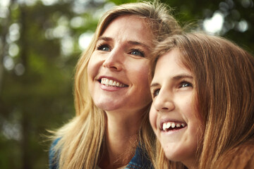 Naklejka premium Thinking, mother and girl in forest, view and woman with weekend break, nature and adventure. Parent, family and mama in woods, daughter and happiness with summer holiday, explore and thoughtful
