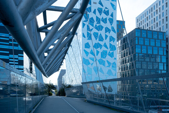 Modern glass facade with geometric patterns in urban Oslo Barcode Norway captured in daylight as corporate architecture detail for branding