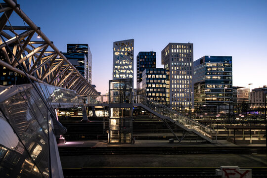 Urban Oslo Barcode Norway night skyline seen through steel bridge structure with modern architecture for corporate transport and design