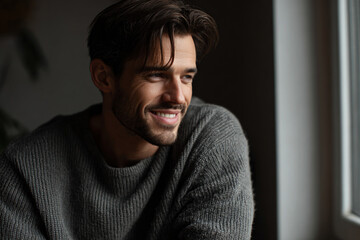 Obraz premium Handsome man with smiling face wearing casual outfit indoor