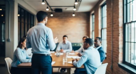 Obraz premium Blurred business meeting in modern office with diverse team discussing strategy and planning future projects while collaborating and sharing ideas in a professional environment