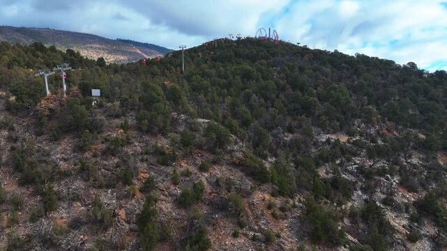 Aerial vew following gondolas up to the Amusement park in Glenwood springs, USA