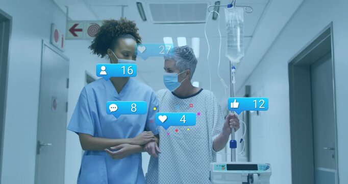 Patient looking at nurse, walking linked in ward as social-badges appearing around IV-pole and them