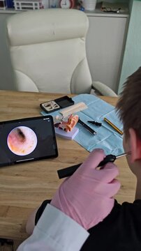 Ear cleaning procedure at a clinic shows detailed view of the process and tools used for safe removal of earwax