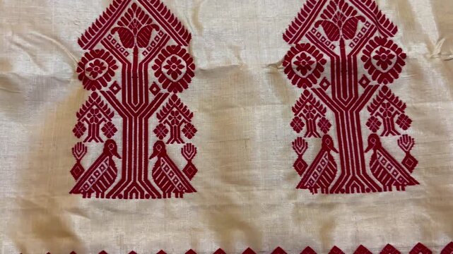 Close up shot of traditional Assamese Toss Muga Chador , Toss Muga Sadoris a premium and traditional attire of Assamese culture, worn mainly by women during the Bihu dance.