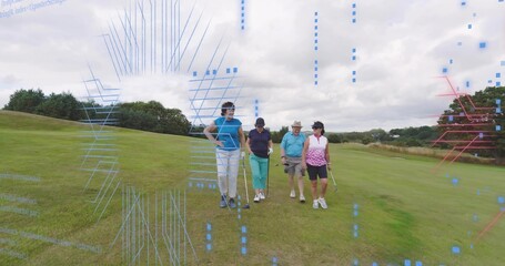Walking four golfers carrying golf clubs on mowed fairway, wearing polo shirts and caps