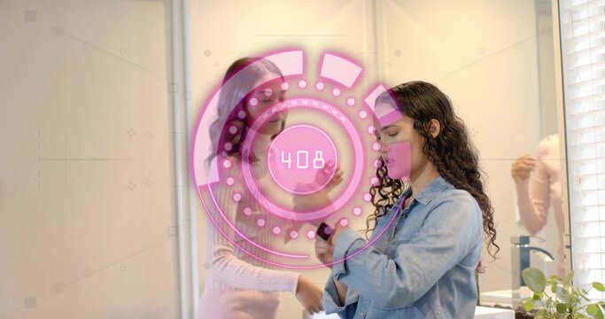 Examining two women wearing denim jacket and pink top applying compact at vanity, with AR 408