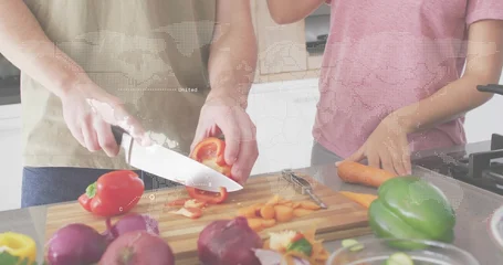 Fotobehang Koken Cutting couple in short sleeves preparing red bell pepper and carrots at home, with cutting board  © vectorfusionart