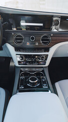Obraz premium Luxury car interior with modern controls and dashboard design for comfortable driving experience