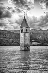 The iconic submerged Church Tower of Graun, Lake Reschensee, Italy