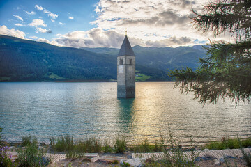 The iconic submerged Church Tower of Graun, Lake Reschensee, Italy