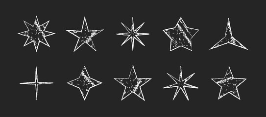 Obraz premium Hand drawn white star shapes with rough chalk texture on a dark background. Grunge doodle stars with distressed outlines and expressive handmade style. Decorative star icons for stickers, collage