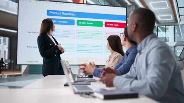 Team Of People In Office Meeting Listening