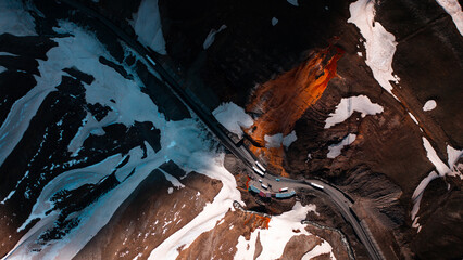 Fototapeta premium Rad mineral waterfall in Gudauri aerial top down view, Georgia