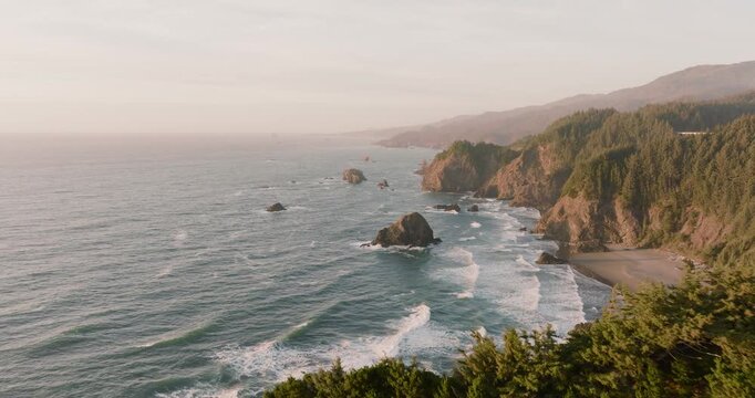 Aerial view of the Oregon coastline where the rough sea meets the steep cliffs, Brookings, Oregon, United States.