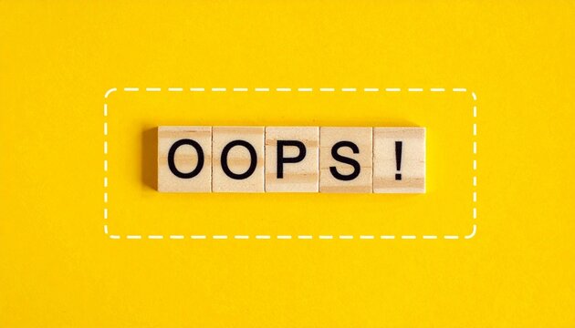 Yellow background with wooden tiles spelling &ldquo;OOPS!&rdquo;.