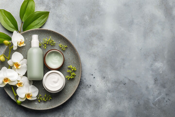 Flat lay of luxury cosmetic cream jar and square box with blank label on spa towel, ready for skincare brand mockup