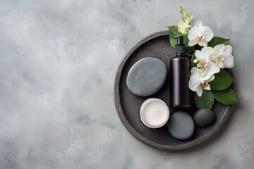 Flat lay of luxury cosmetic cream jar and square box with blank label on spa towel, ready for skincare brand mockup
