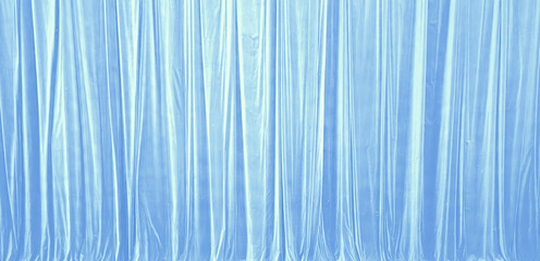 Fototapeta premium Light Blue Silk Curtain Background With Vertical Drapery Folds